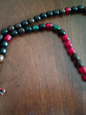 Multicolored rosary worry beads used with knitted cross and bakelite beads