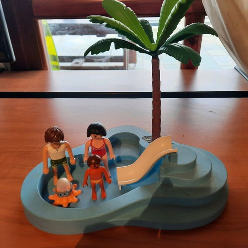 Playmobil beach set like new with 3 figures, octopus, palm tree and slide