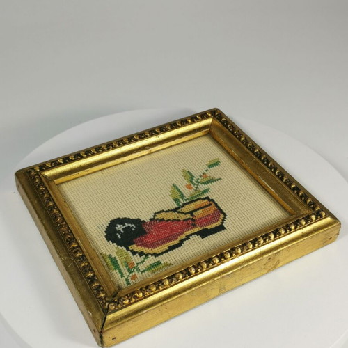 Vintage embroidered frame with traditional tsarouhi used