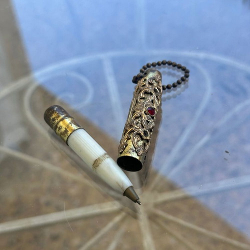 Vintage decorative pen with metal case and red stone used