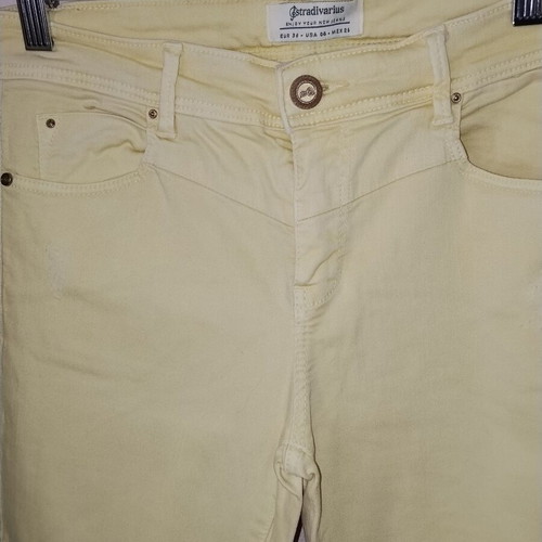 Stradivarius pastel yellow skinny jeans like new, distressed style