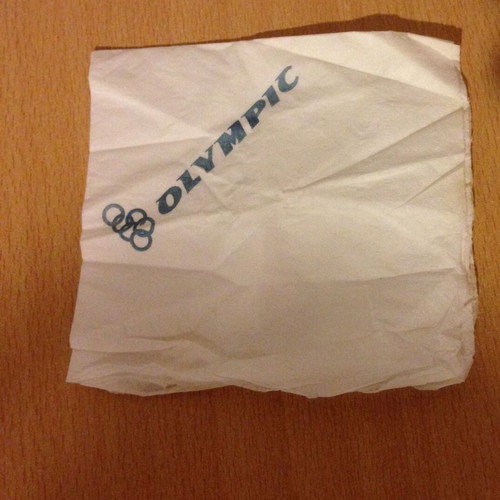 Olympic napkin with small tear