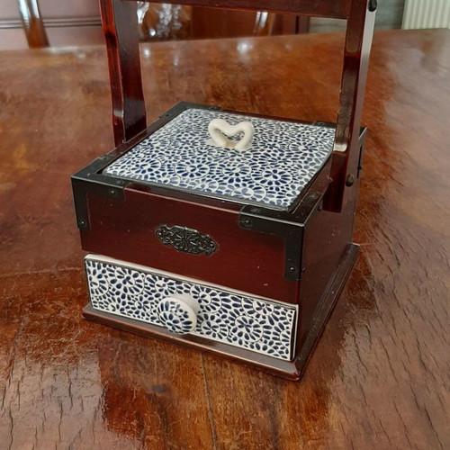 Decorative box used with cherry wood and porcelain