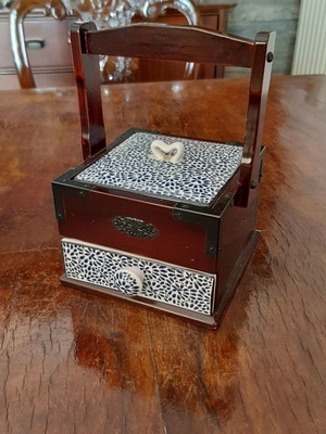 Decorative box used with cherry wood and porcelain