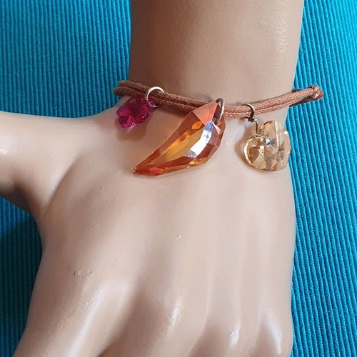 Adjustable bracelet used with brown and multicolor crystals