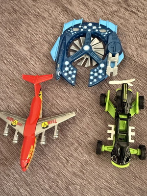 Toy vehicles used with Matchbox blue ship and flying car