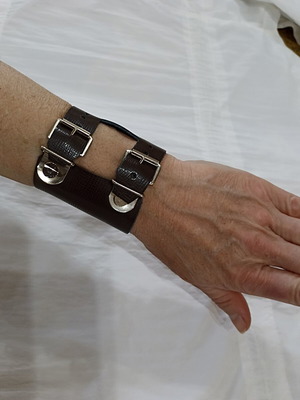 Wide black synthetic leather bracelet with two buckles