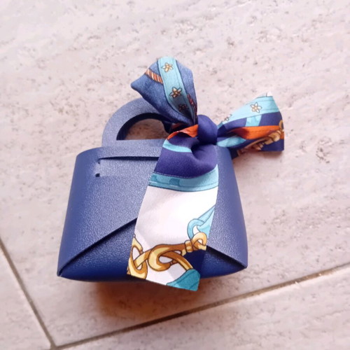 Gift packaging bag made of artificial leather new, blue with ribbon