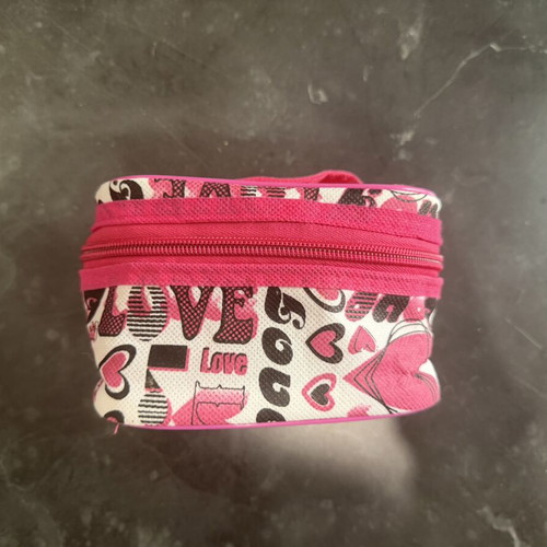 Small toiletry bag used, black and pink