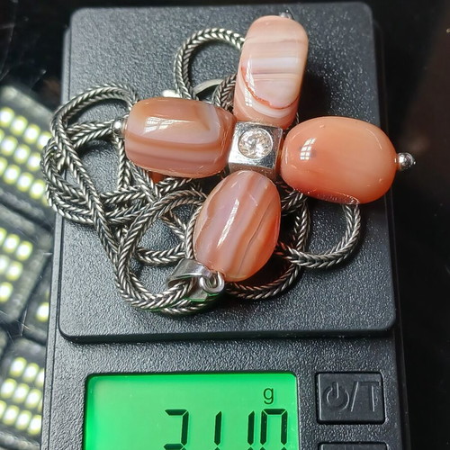 Silver necklace cross with carnelian stones used