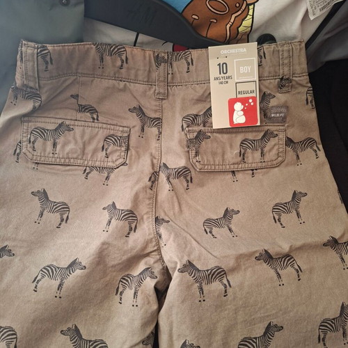 Package with 1 Zara vest 8-9 years, 1 new Orchestra shorts and 1 free t-shirt