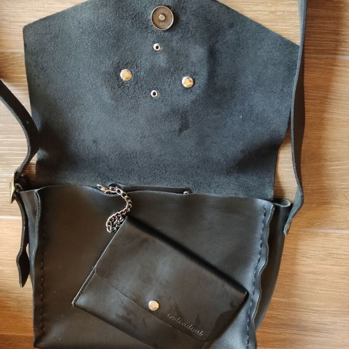 Leather crossbody bag used black with silver elephant buckle