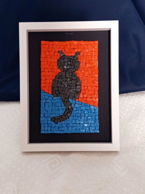 Mosaic framed artwork with black cat design