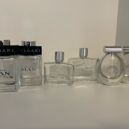 Collection of 44 empty genuine perfume bottles, various brands