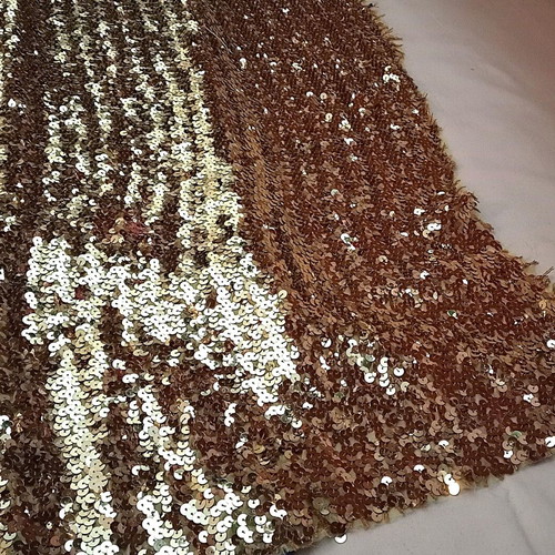 Stable fabric with gold sequins used