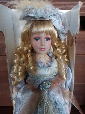 Porcelain doll with stand new, vintage style