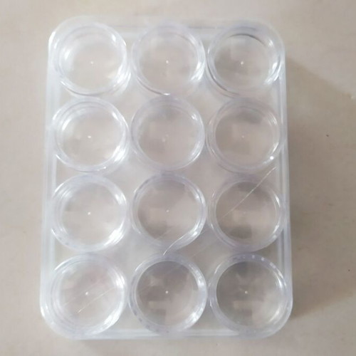 Transparent circular capsules like new, box of 12 pieces