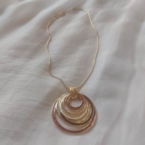 Golden Orbit statement necklace with circular pendant