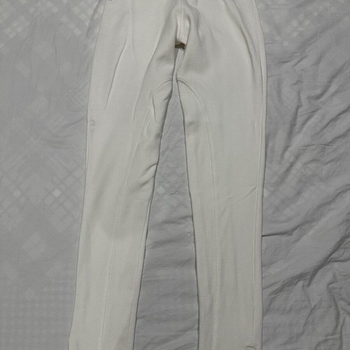 White elastic slim fit pants with ankle zippers