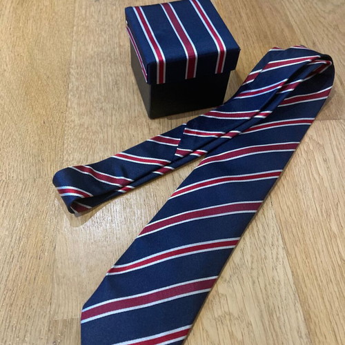Silk tie new with matching box, blue and red