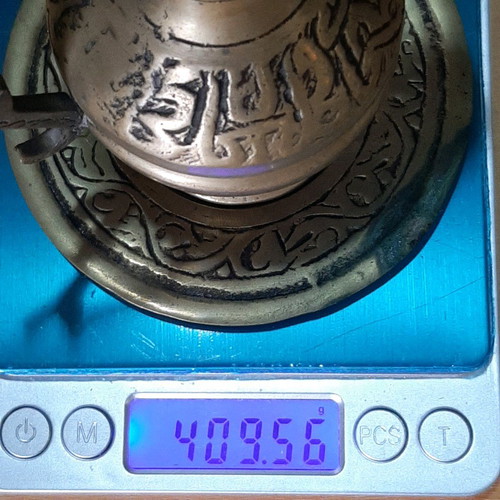Oriental solid brass pitcher used with saucer