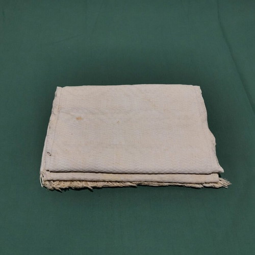 Woven piqué blanket used with wear from 1930 era