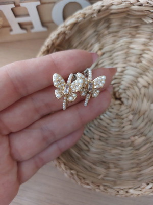 Earrings with white stones in butterfly shape