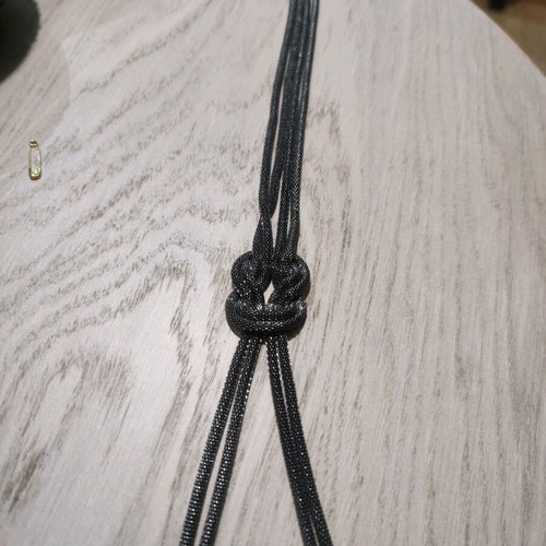 Long silver necklace like new with braid design in the middle