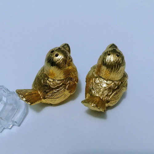 Set of gilded miniature salt and pepper shakers with lead tray