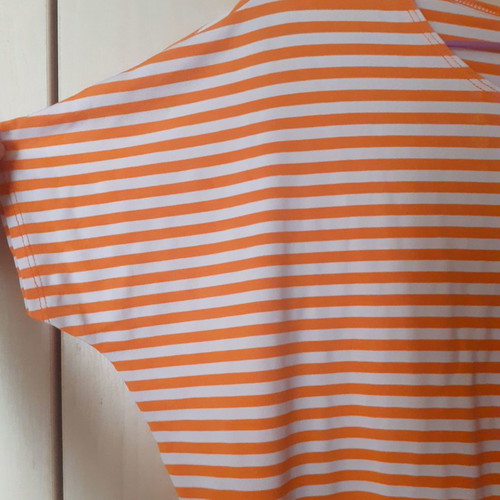 Women's short orange striped top with wide sleeves