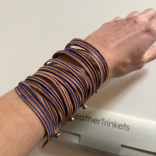 Leather bracelet used brown with blue details