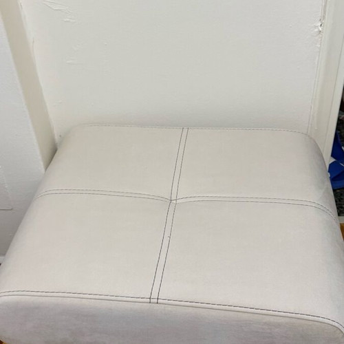 Three-seater sofas used with two stools and storage space
