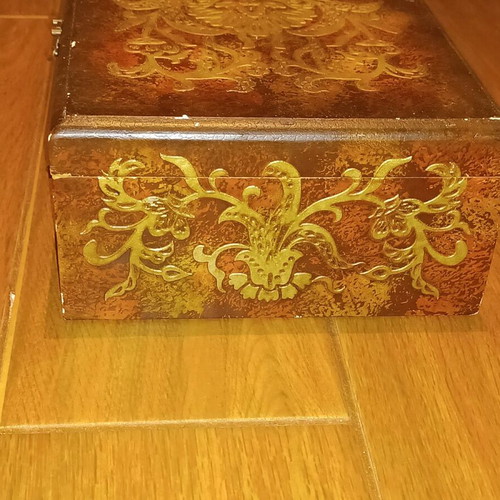 Wooden antique box used with embossed bronze decorations