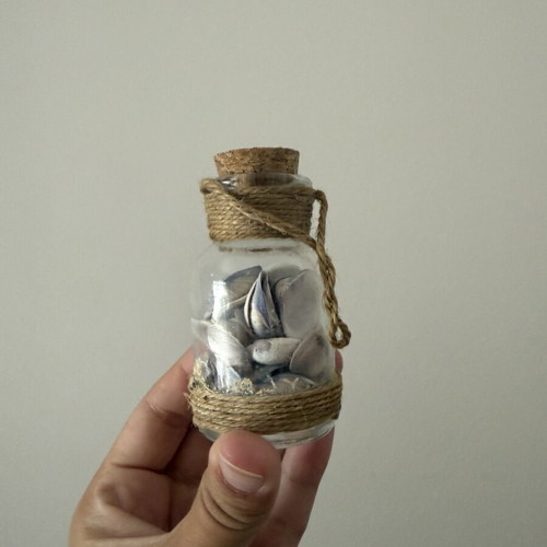 Mini jar with seashells like new