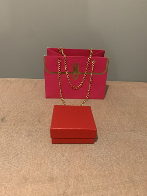 Gift packaging set with pink paper bag and red box
