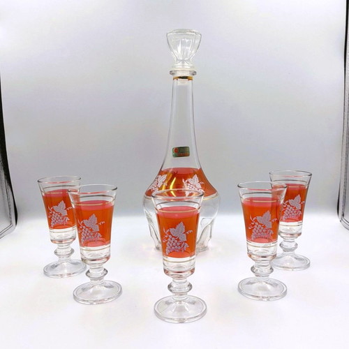Italian glass decanter with glasses used, red with gold details
