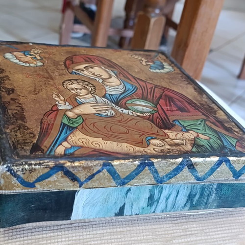 Cardboard box with silk-screened religious icon on canvas