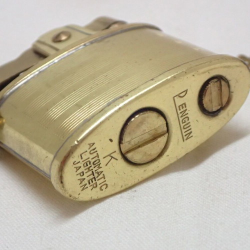 Vintage Penguin K Automatic Lighter made of brass, like new