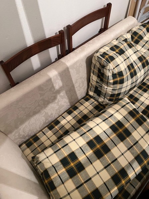 Two-seater sofa bed new with embossed beige cover