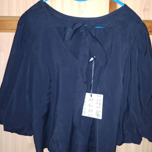 Elegant blouse with bow on back, new