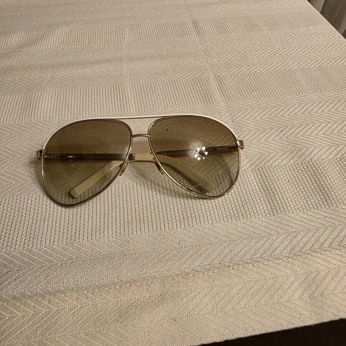 Gucci sunglasses used, white and gold