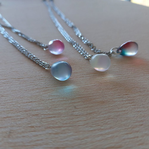 Handmade pendants from iridescent glass and steel