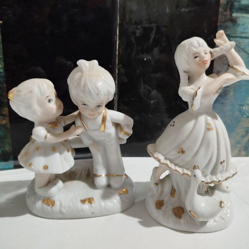 Porcelain figurines set used, young girl with goose and children