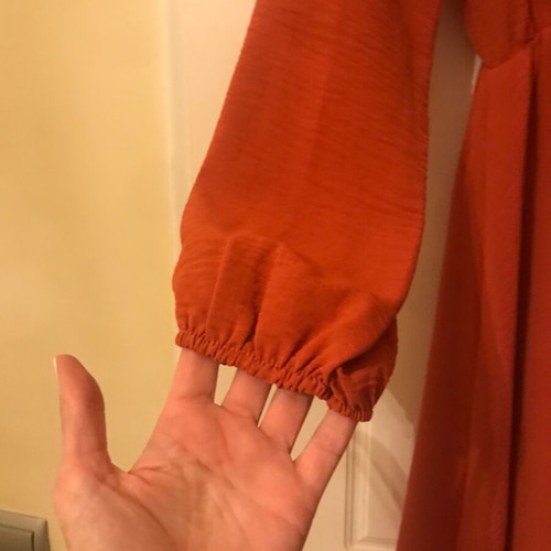 Coral dress like new with ruffles and front frill