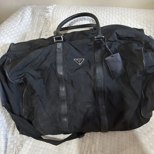 Prada travel bag like new, large black with handles and shoulder strap