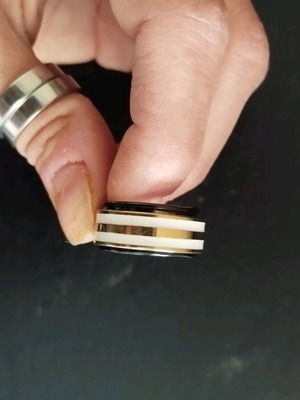 Fidget ring stainless steel like new, black and gold colors