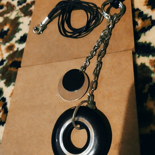 Necklace used, black and silver pendant