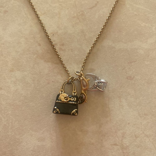 Juicy Couture necklace with gold chain and adjustable rings, like new