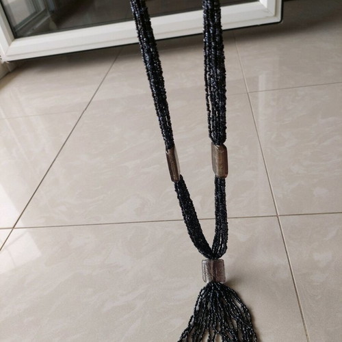 Necklace new with thin black beads and gray transparent stones