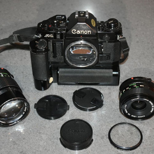 Canon A-1 collectible pack like new with Motor Drive, strap and 35mm f/2.8, 135mm lenses